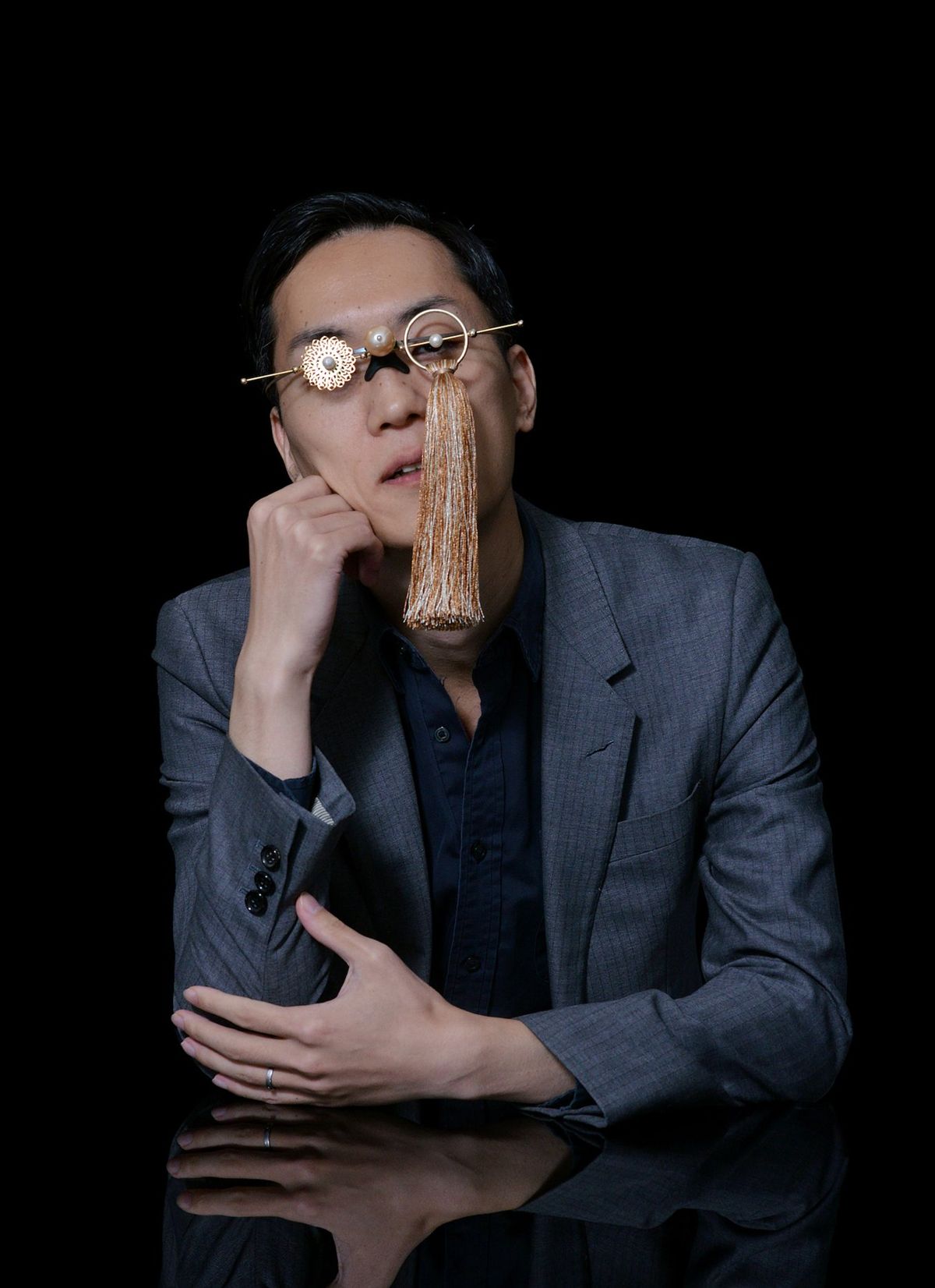 Shuhei Okawara, wearing a jewelled eye-piece mask